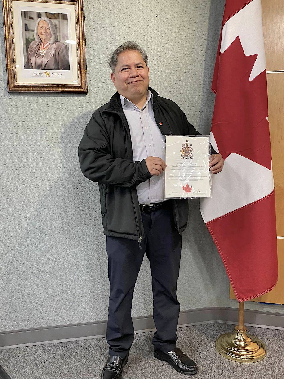 A proud José Figueroa displayed his certificate on Oct. 19, the day he became a Canadian citizen, ending a 13-year-battle to remain in his adopted country that saw the Langley City resident seek sanctuary in a Walnut Grove church. (Special to Langley Advance Times)