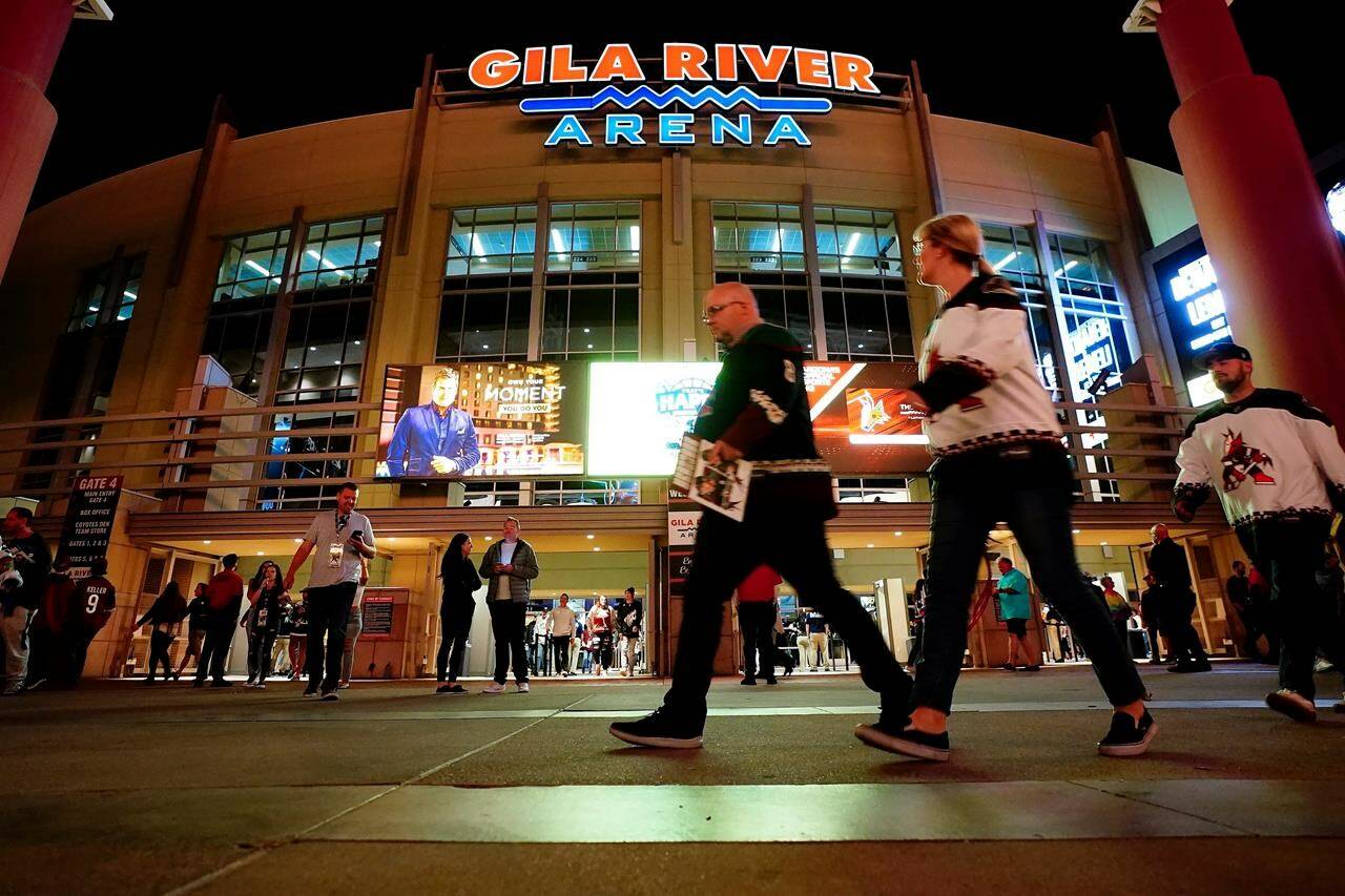 Arizona Coyotes fans leave the Gila River Arena after an NHL hockey game between the Coyotes and the Nashville Predators Friday, April 29, 2022, in Glendale, Ariz., the team’s final game at the facility. The Coyotes begin life at Arizona State University on Friday when they host the Winnipeg Jets following a six-game road trip to open the schedule. THE CANADIAN PRESS/AP /Ross D. Franklin