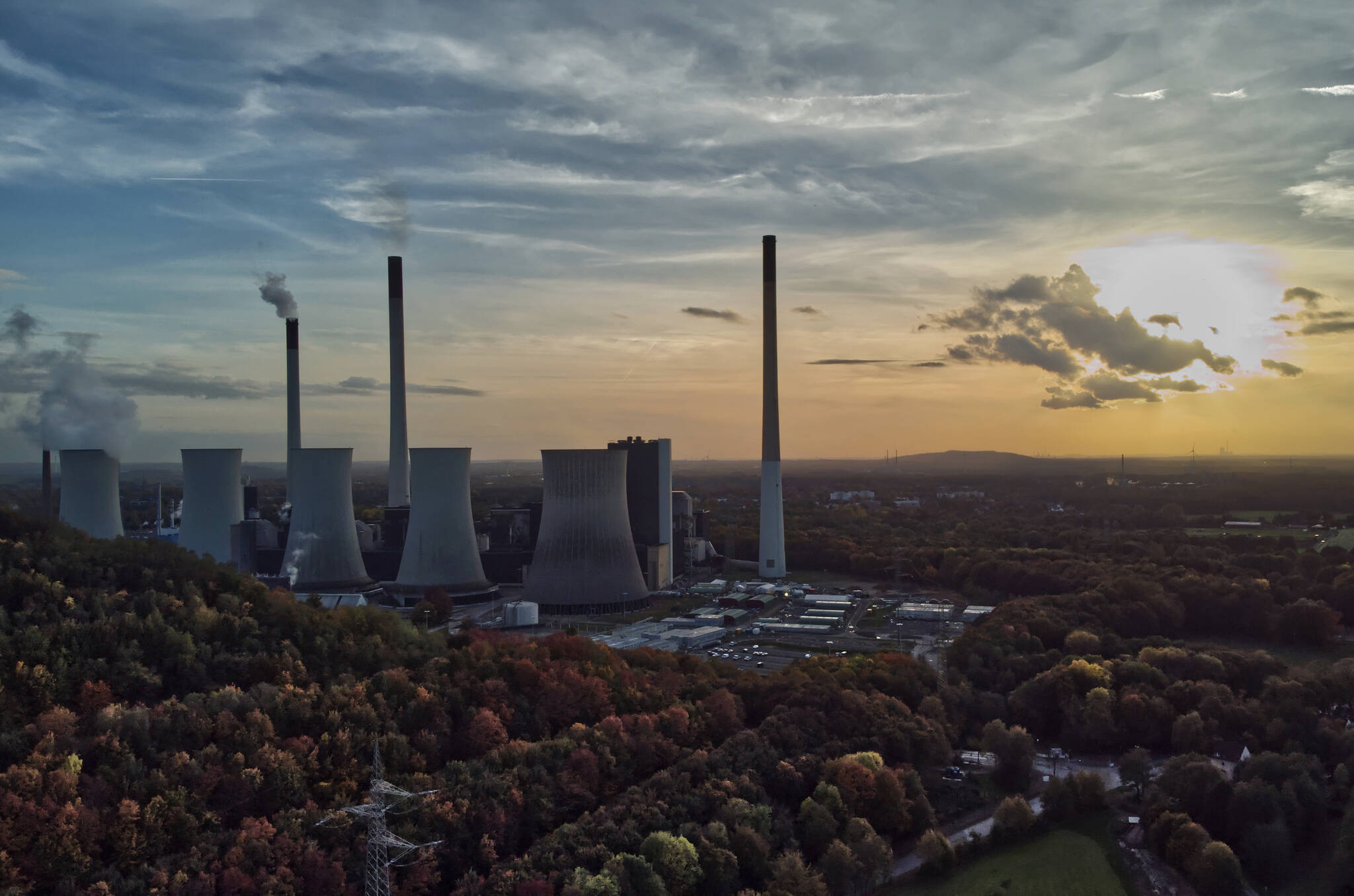 FILE - The sun sets behind a coal-fired power plant in Gelsenkirchen, Germany, Oct. 22, 2022. (AP Photo/Michael Sohn, File)