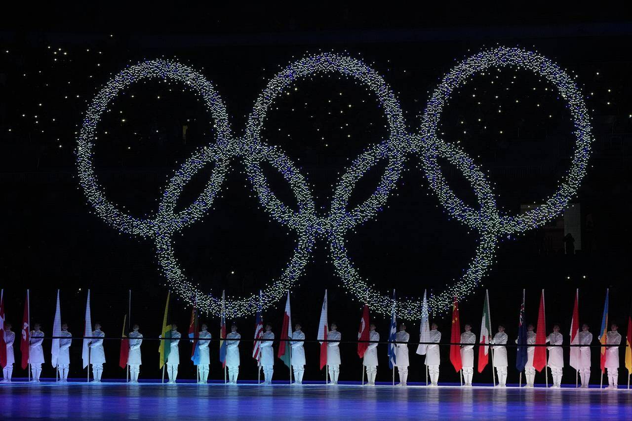 FILE - The Olympic rings are seen during the closing ceremony of the 2022 Winter Olympics on Feb. 20, 2022, in Beijing. (AP Photo/Natacha Pisarenko, File)
