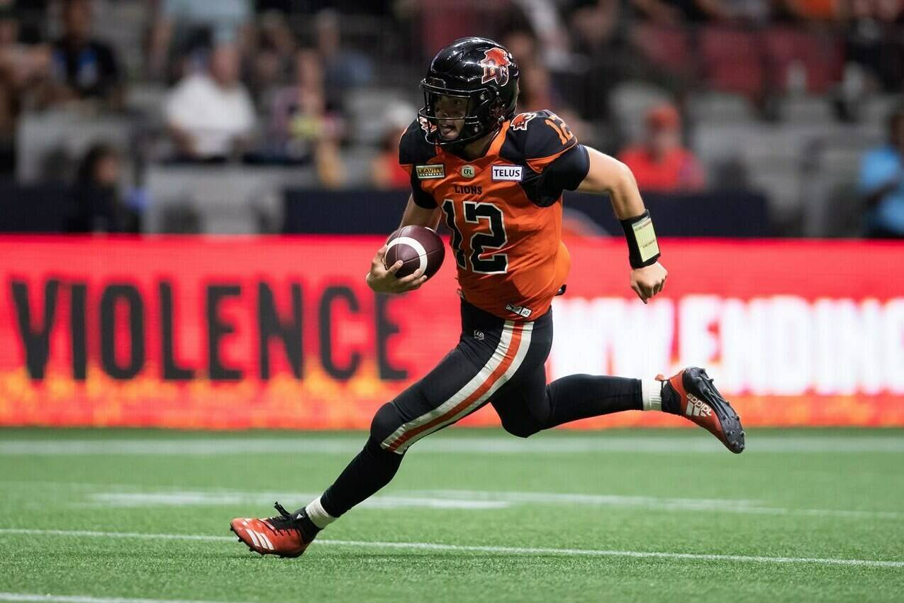 B.C. Lions quarterback Nathan Rourke runs for a touchdown during the second half of CFL football game against the Edmonton Elks in Vancouver, on Saturday, August 6, 2022. THE CANADIAN PRESS/Darryl Dyck