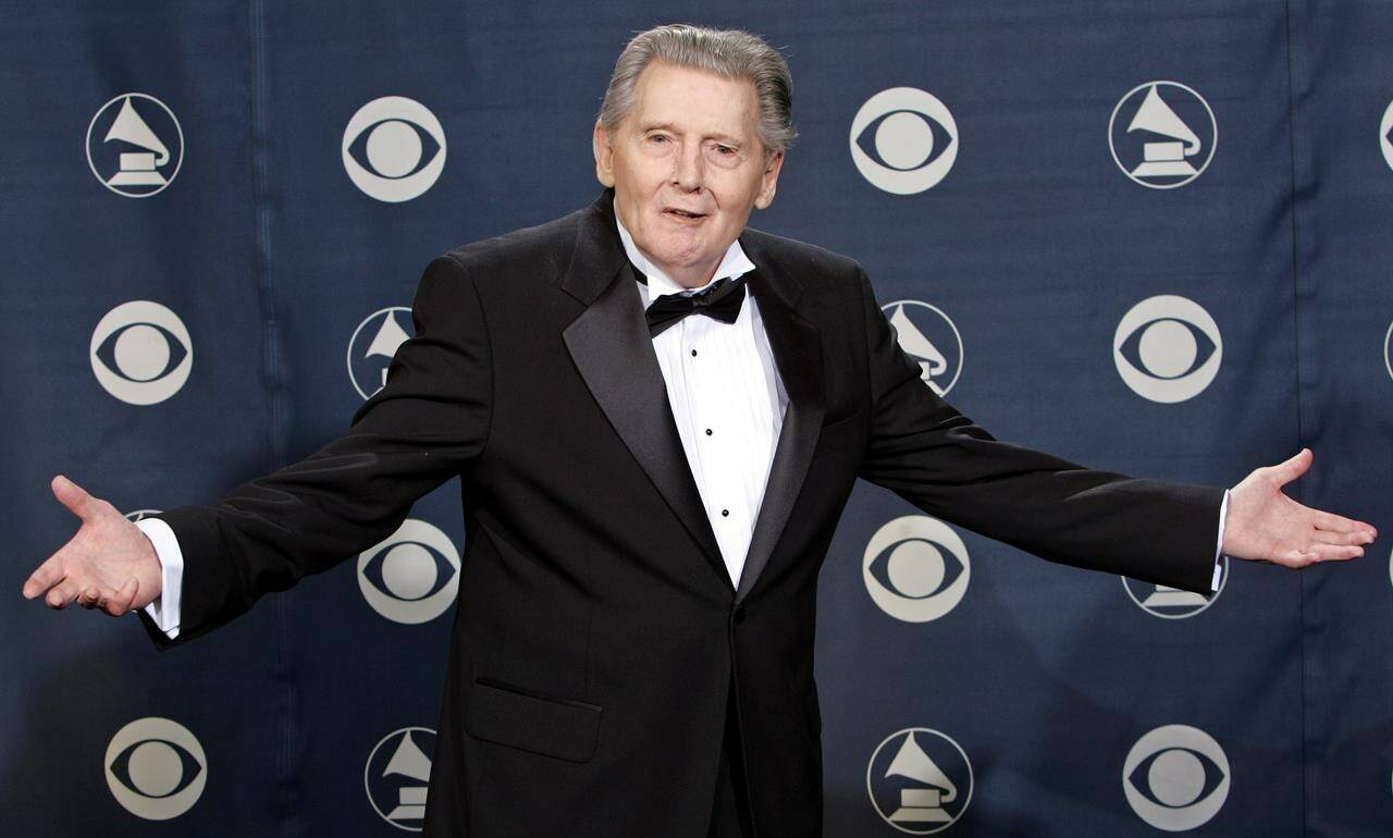 FILE - Lifetime achievement award winner Jerry Lee Lewis poses for photographers at the 47th Annual Grammy Awards on Sunday, Feb. 13, 2005, at the Staples Center in Los Angeles. Spokesperson Zach Furman said Lewis died Friday morning, Oct. 28, 2022, at his home in Memphis, Tenn. He was 87. (AP Photo/Reed Saxon, File)