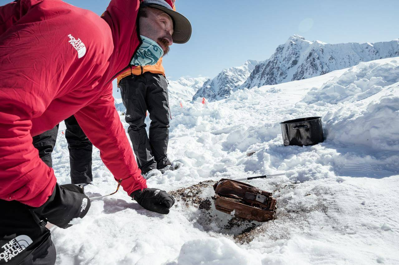 Griffin Post looks over parts of an 85-year-old cache belonging to famed explorer Bradford Washburn in a handout photo. Post led the team that discovered the cache on Yukon’s Walsh glacier.THE CANADIAN PRESS/HO, Leslie Hittmeier