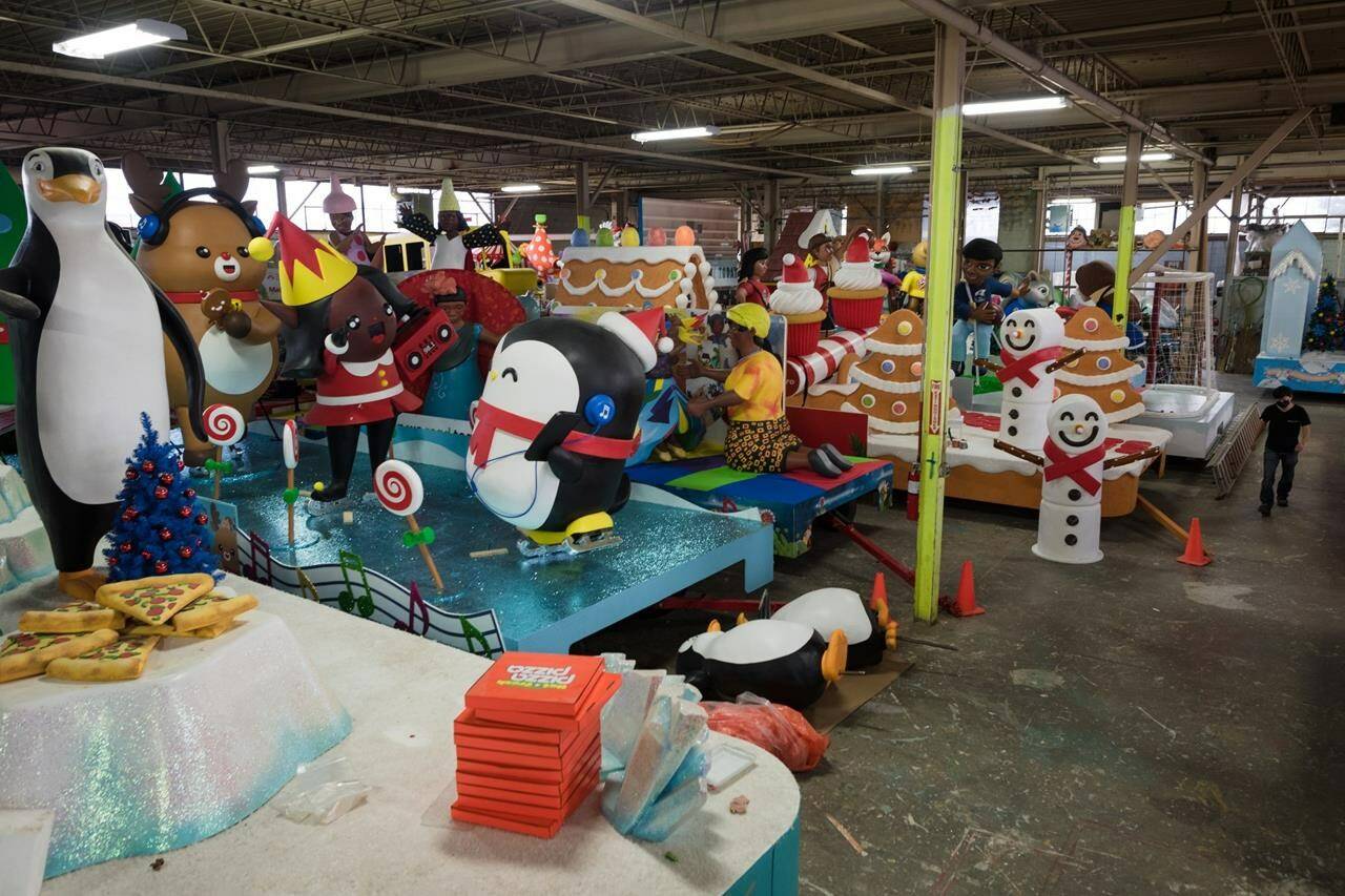 A staff member walks through Santa’s Secret Workshop, ahead of the virtual Santa Claus Parade, in Toronto on Wednesday, December 1, 2021. The Santa Claus Parade in downtown Vancouver has been cancelled for a third straight year because of lack of sponsorship. THE CANADIAN PRESS/Tijana Martin