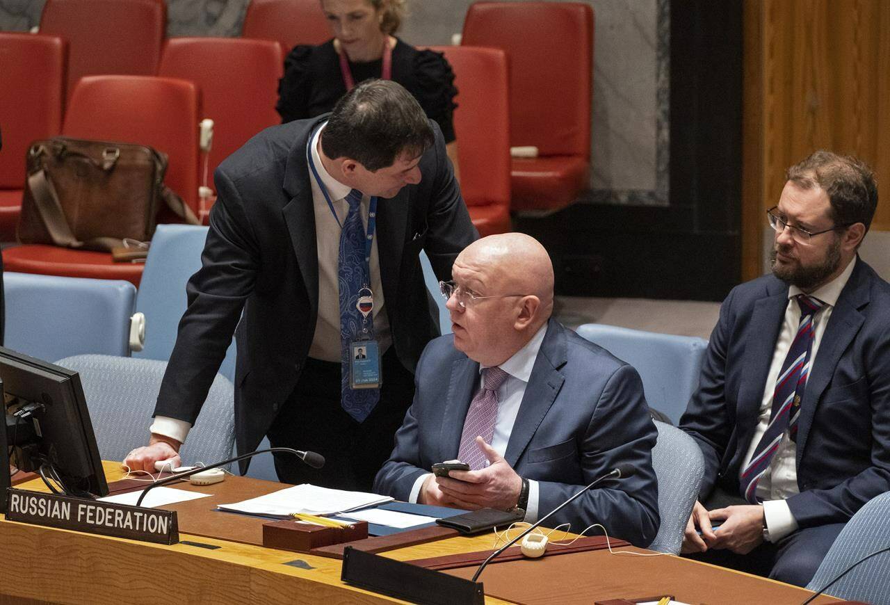 Russian Ambassador to the United Nations Vasily Nebenzya confers with counterparts after arriving to address the Security Council during a session to discuss the situation with grain shipments from Ukraine at United Nations headquarters, Monday, Oct. 31, 2022. (AP Photo/Craig Ruttle)