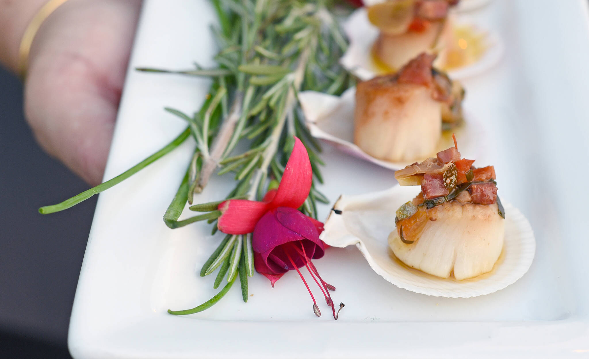 September 9, 2022 -  An appetizer,  grilled scallop from Truffles Catering for a corporate event held on the Ship Point dock. Don Denton photo