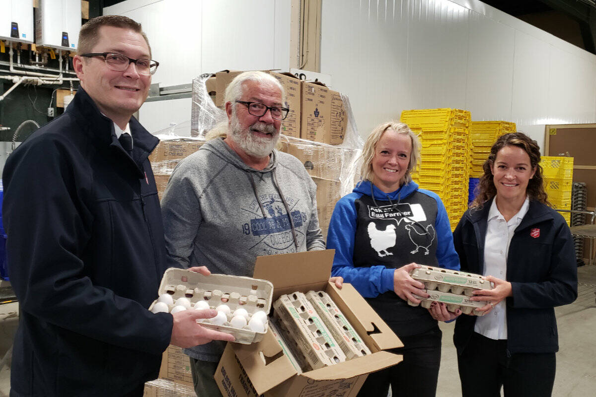 From left to right, Salvation Army Captain Matt Kean, Chilliwack Food Bank co-ordinator Don Armstrong, Chilliwack farmer Larissa Garcia, and Captain Fiona Kean. (BC Egg photo)
