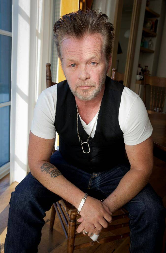FILE - Singer-songwriter John Mellencamp poses for a portrait at the Greenwich Hotel, on Sept. 22, 2014 in New York. Mellencamp’s 1985 album “Scarecrow” is being reissued this week. (Photo by Amy Sussman/Invision/AP, File)