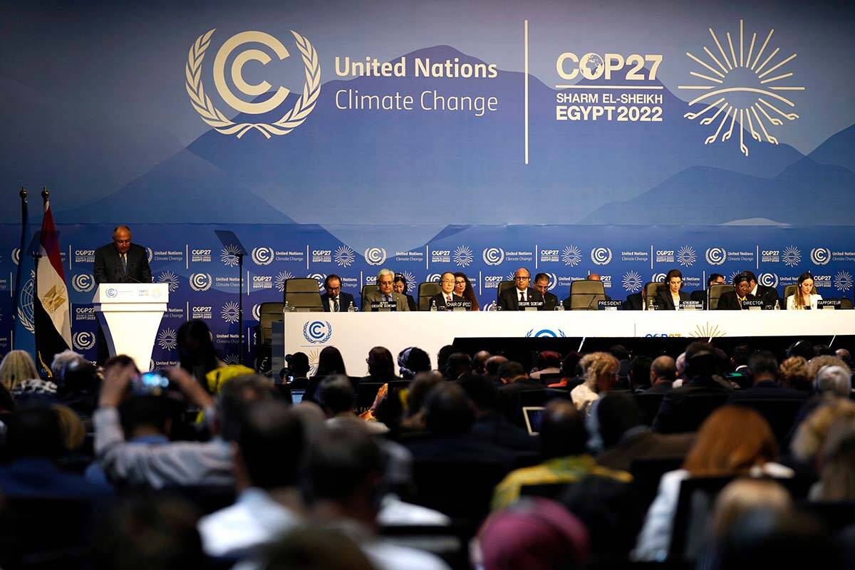 Sameh Shoukry, president of the COP27 climate summit, left speaks during an opening session at the COP27 U.N. Climate Summit, Sunday, Nov. 6, 2022, in Sharm el-Sheikh, Egypt. (AP Photo/Peter Dejong)