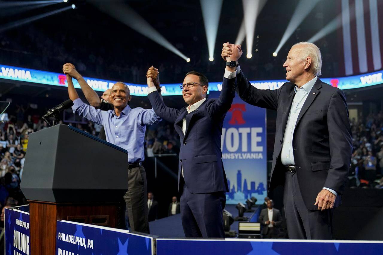 President Joe Biden stands on stage with Pennsylvania’s Democratic gubernatorial candidate Josh Shapiro, second from right, former President Barack Obama, left, and Democratic Senate candidate Lt. Gov. John Fetterman, obscured, at the end of a campaign rally Saturday, Nov. 5, 2022, in Philadelphia. THE CANADIAN PRESS/AP-Patrick Semansky