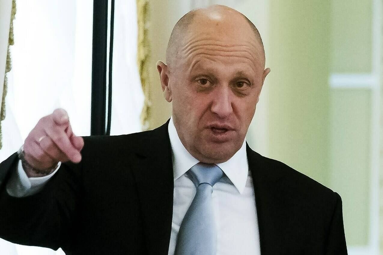 FILE - businessman Yevgeny Prigozhin gestures on the sidelines of a summit meeting between Russian President Vladimir Putin and Turkish President Recep Tayyip Erdogan at the Konstantin palace outside St. Petersburg, Russia, on Tuesday, Aug. 9, 2016. Prigozhin, an entrepreneur known as “Putin’s chef” because of his catering contracts with the Kremlin, has admitted he interfered in U.S. elections and says he will continue to do so — for the first time confirming the accusations he has been rejecting for years. “We have interfered, are interfering and will continue to interfere. (AP Photo/Alexander Zemlianichenko, File)