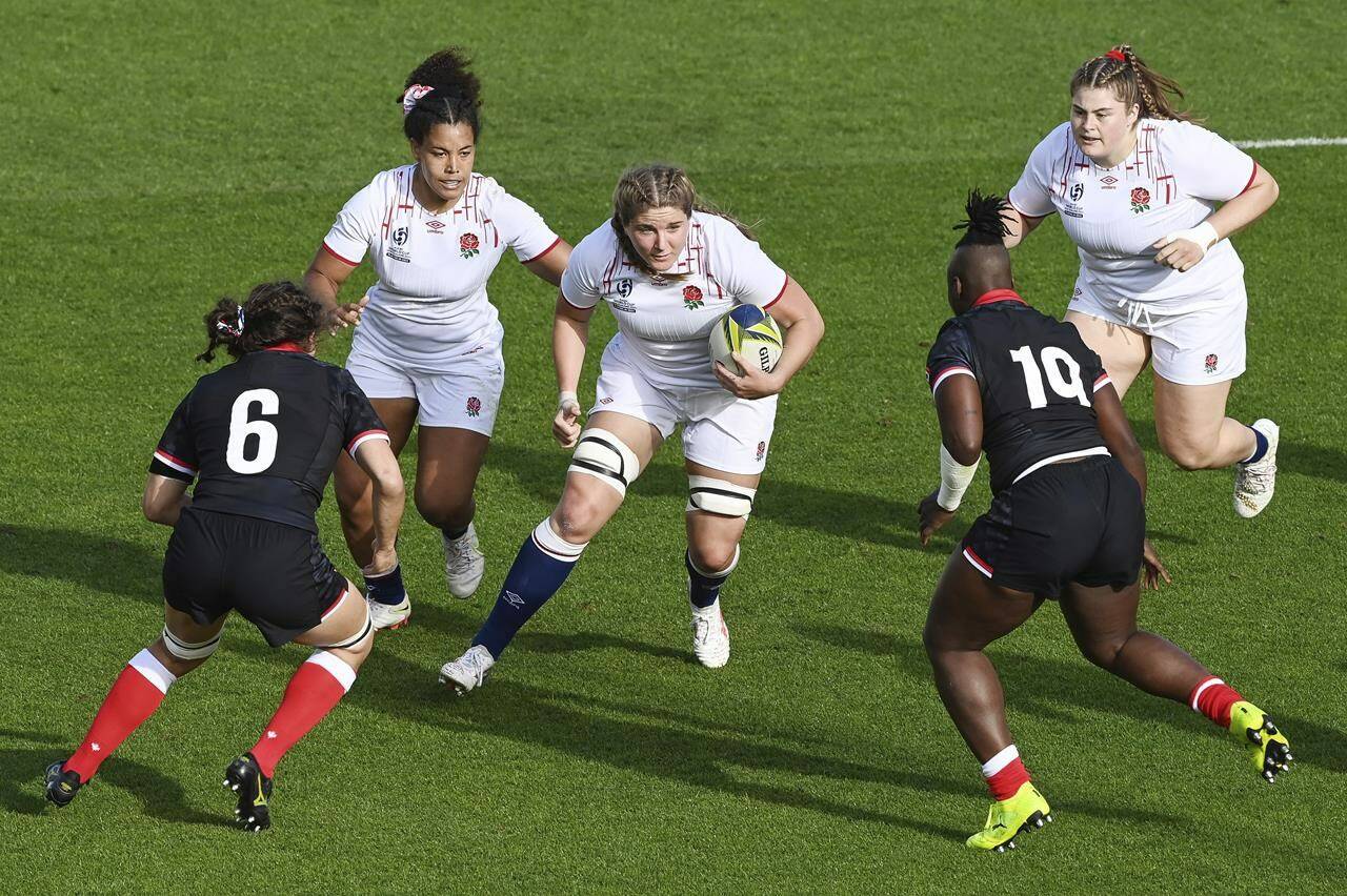 Sarah Bern of England runs at the defense during the women’s rugby World Cup semifinal between Canada and England at Eden Park in Auckland, New Zealand, Saturday, Nov.5, 2022. THE CANADIAN PRESS/AP-Photosport, Andrew Cornaga