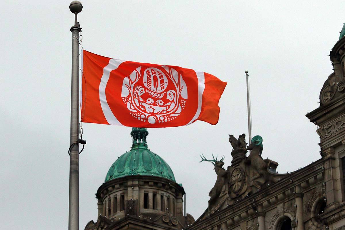 The Survivors’ Flag hangs to honour Indigenous Peoples who were forced to attend residential schools, on the grounds of the legislature in Victoria, B.C., on Wednesday, September 28, 2022. THE CANADIAN PRESS/Chad Hipolito