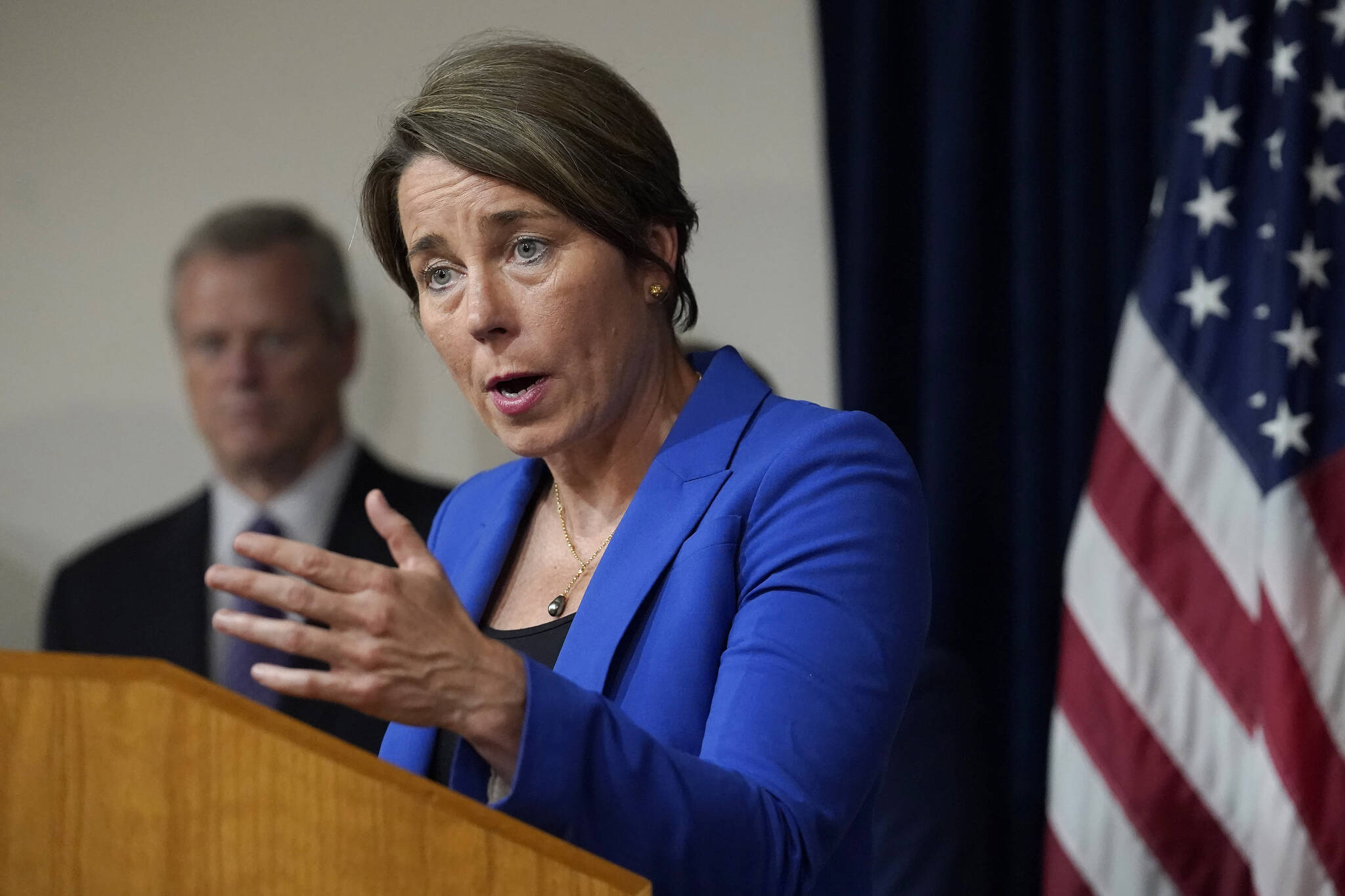 Massachusetts Attorney General Maura Healey, right, faces reporters as Mass. Gov. Charlie Baker, left, looks on during a news conference, in Boston, Thursday, July 8, 2021. (AP Photo/Steven Senne)