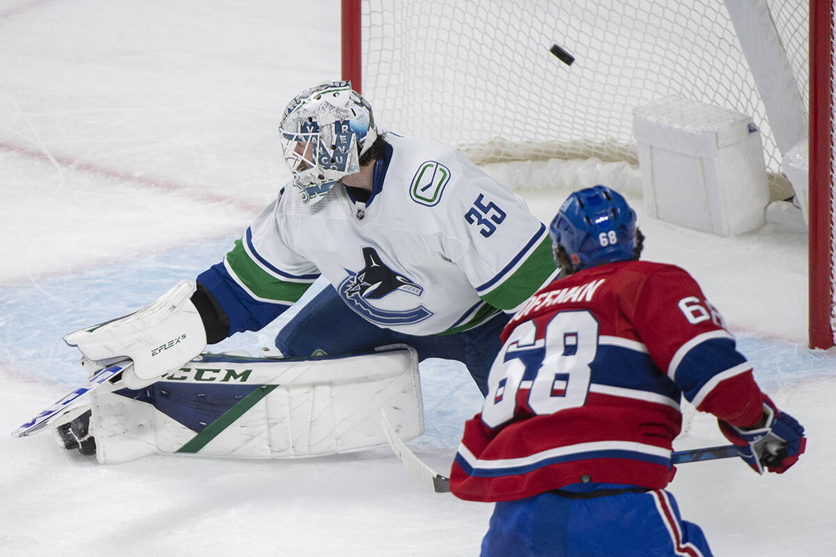 Montreal Canadiens’ Mike Hoffman (68) scores against Vancouver Canucks goaltender Thatcher Demko during second period NHL hockey action in Montreal, Wednesday, November 9, 2022. THE CANADIAN PRESS/Graham Hughes