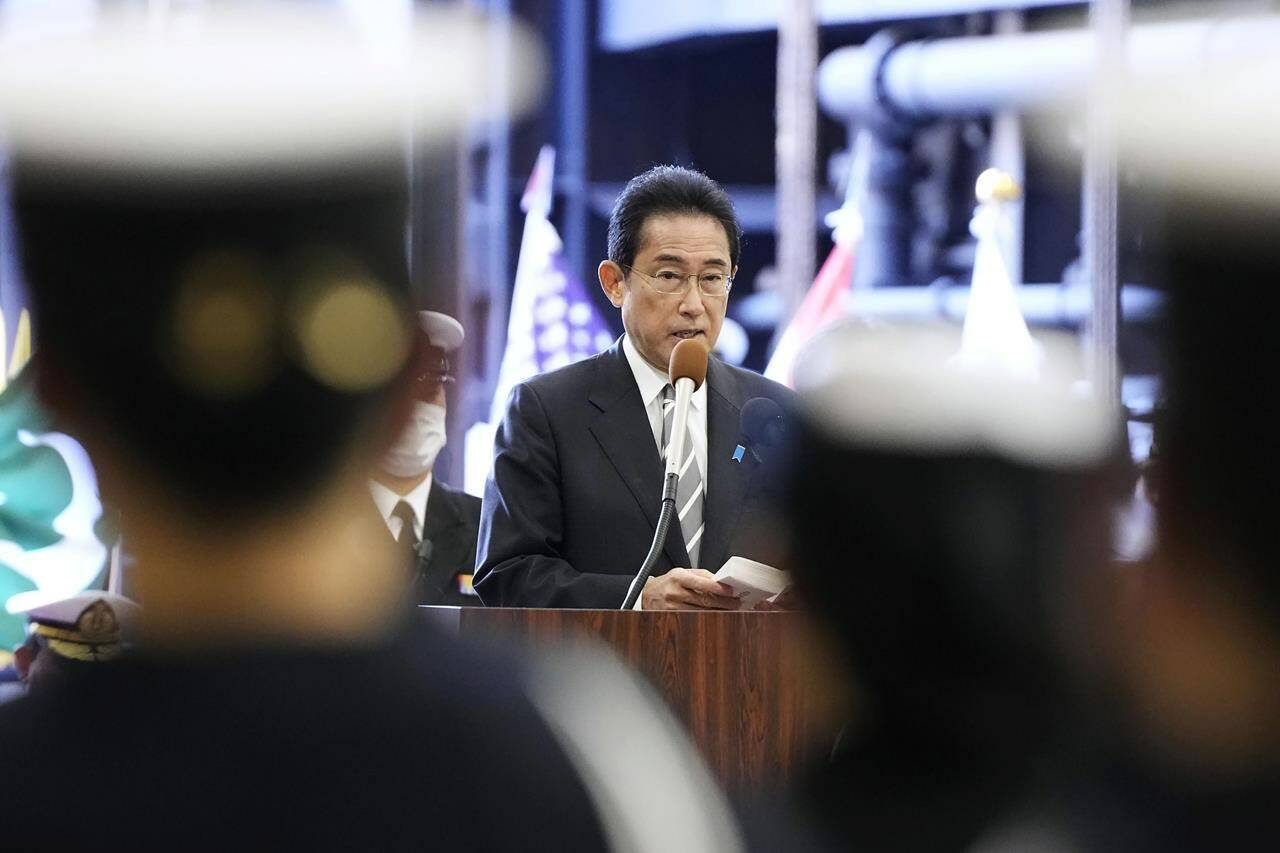 FILE - Japanese Prime Minister Fumio Kishida delivers a speech on the Maritime Self Defense Force’s helicopter carrier JS Izumo during an international fleet review in Sagami Bay, southwest of Tokyo on Nov. 6, 2022. Japan and the United States began a major joint military exercise Thursday, Nov. 10, 2022 in southern Japan as the allies aim to step up readiness in the face of China’s increasing assertiveness and North Korea’s intensifying missile launches. (Kyodo News via AP, File)
