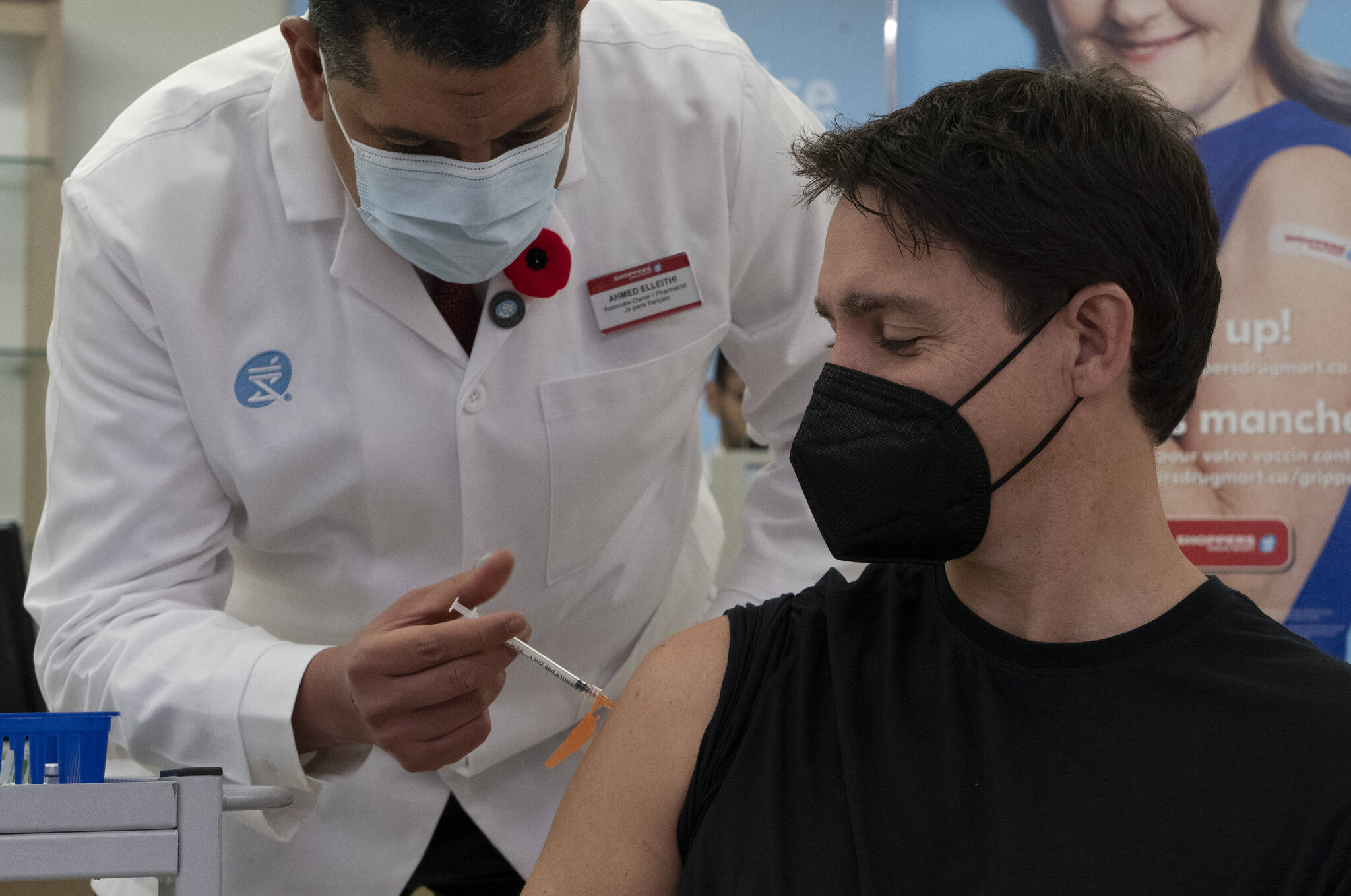Pharmacists Ahmed Elleithi gives Prime Minister Justin Trudeau a flu vaccination, Wednesday, November 9, 2022 in Ottawa. THE CANADIAN PRESS/Adrian Wyld