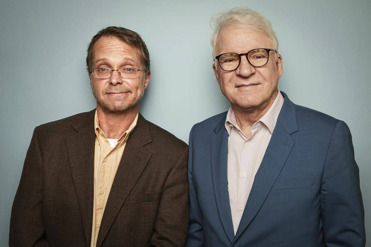 Harry Bliss, left, and Steve Martin pose for a portrait to promote the book “A Wealth of Pigeons: A Cartoon Collection” on Thursday, Nov. 3, 2022, in New York. (Photo by Matt Licari/Invision/AP)