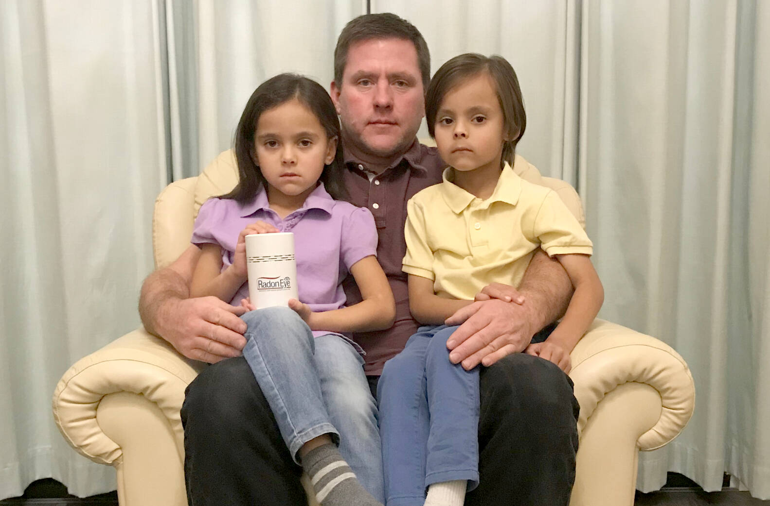 Tony Gore with children Naomi (left) and Wyatt (right). Tony and his sister, Jill Hall, started sounding the alarm about radon after he found alarming levels of the radioactive gas in Naomi’s second-floor bedroom. Naomi is seen here holding a home radon test. (submitted photo)