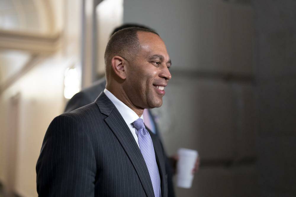 FILE - House Democratic Caucus Chair Hakeem Jeffries, D-N.Y., arrives to meet with his fellow Democrats, at the Capitol in Washington, Thursday, Nov. 17, 2022. The day after Speaker Nancy Pelosi announced she would step aside, Jeffries announced his own history-making bid Friday to become the first Black American to helm a major U.S. political party in Congress as leader of the House Democrats. (AP Photo/J. Scott Applewhite, File)