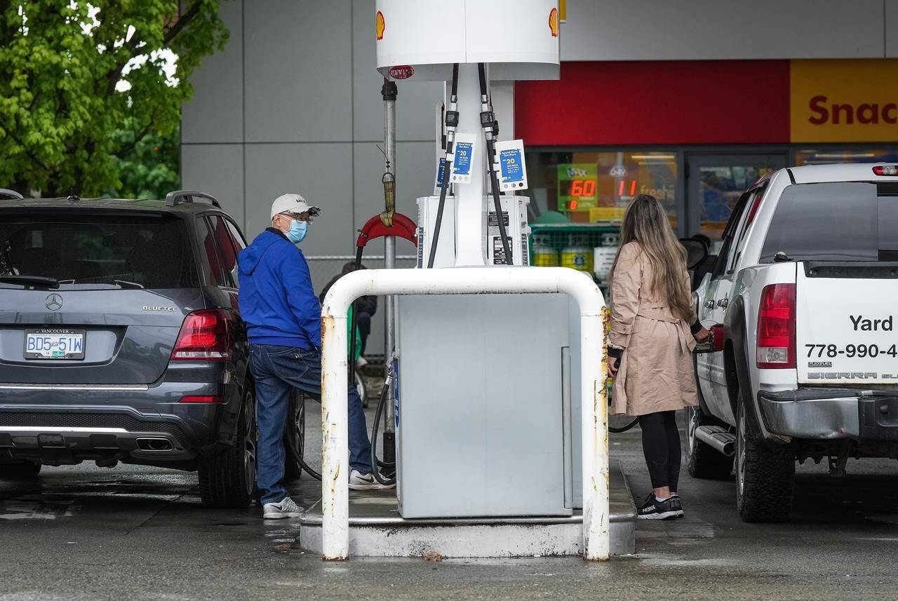 Statistics Canada says retail sales fell 0.5 per cent to $61.1 billion in September led by a drop in sales at gasoline stations and food and beverage stores. People fuel up vehicles at a Shell gas station in Vancouver, on Saturday, May 14, 2022. THE CANADIAN PRESS/Darryl Dyck