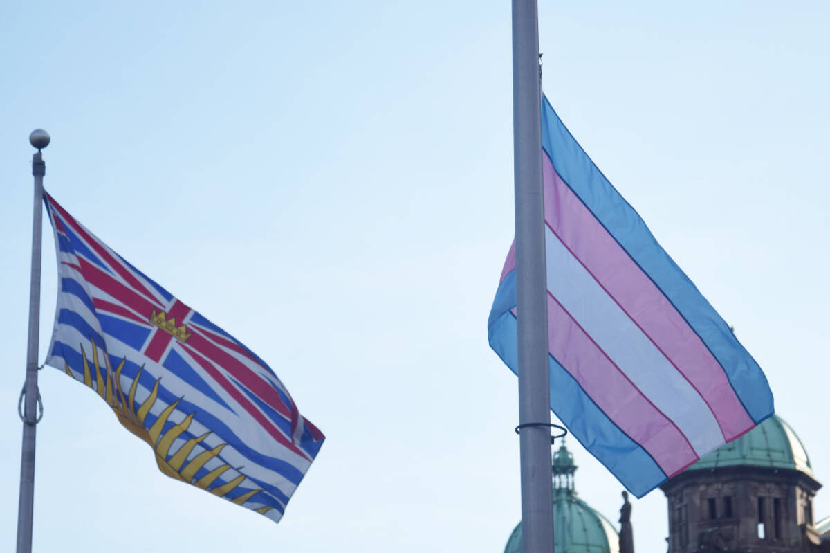 The B.C. and transgender flags fly together at the B.C. legislature in Victoria on Sunday (Nov. 20) in recognition of Transgender Day of Remembrance. (Austin Westphal/News Staff)