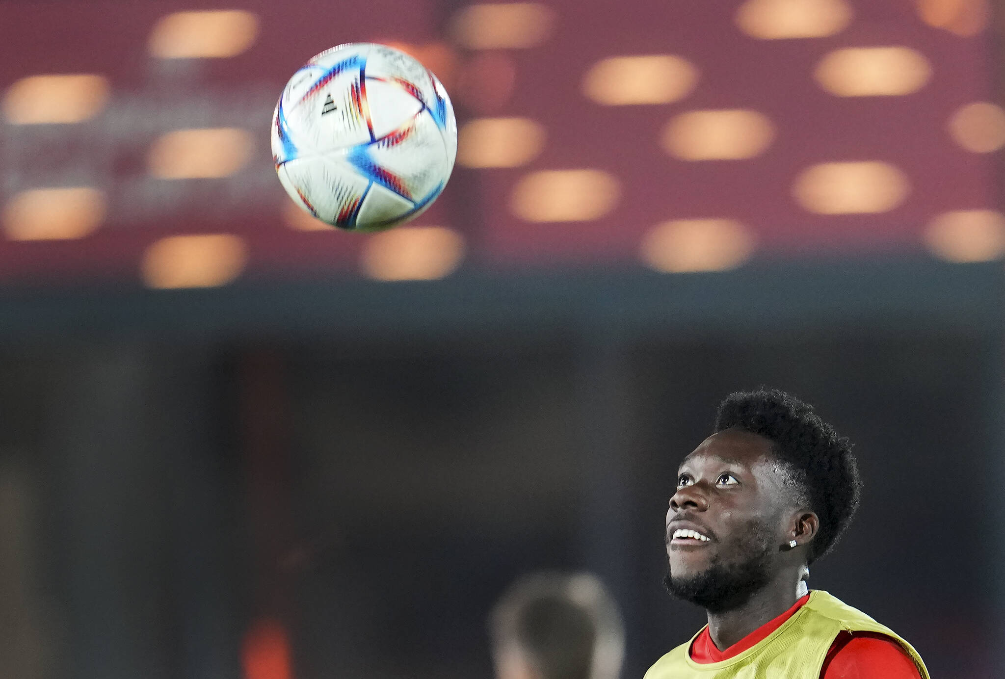 Canada forward Alphonso Davies eyes the ball during practice at the World Cup in Doha, Qatar, Tuesday, Nov. 22, 2022. THE CANADIAN PRESS/Nathan Denette
