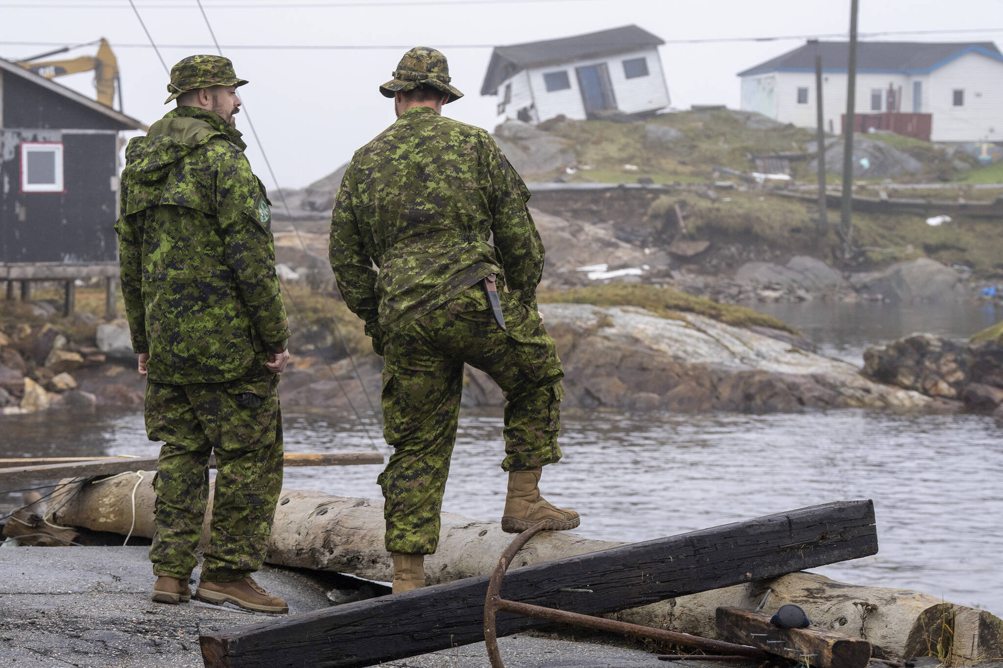 Canadian Armed Forces members from St John’s survey the devastation left by hurricane Fiona in Burnt Island, Newfoundland on Wednesday September 28, 2022. A Nova Scotia legislature committee has been told about the importance of supporting military members who want to transition to a skilled trade upon leaving the service. THE CANADIAN PRESS/Frank Gunn