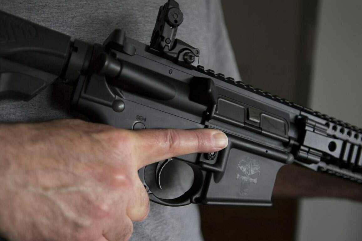 A restricted gun licence holder holds a AR-15 at his home in Langley, B.C. Friday, May 1, 2020. Members of the House of Commons public safety committee have begun a clause-by-clause review of the Liberal government's gun-control bill. THE CANADIAN PRESS/Jonathan Hayward