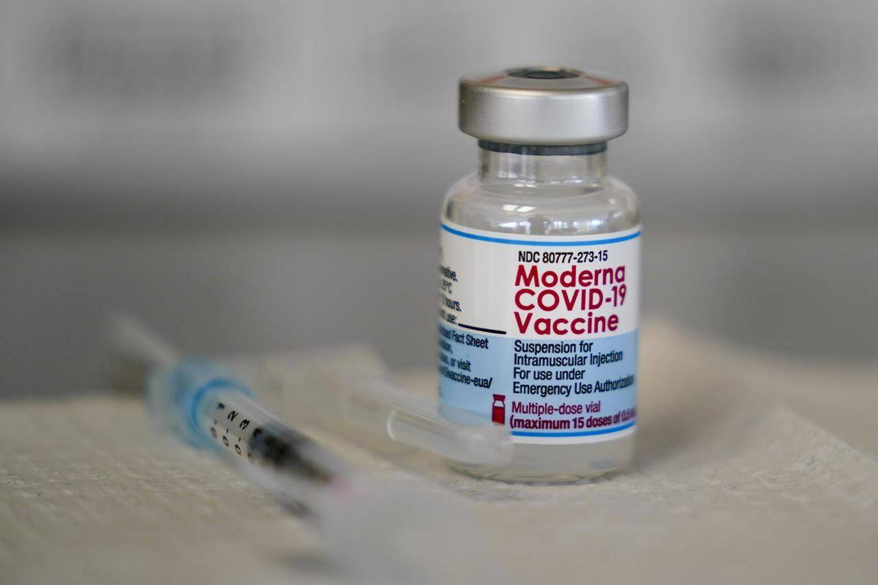 A vial of the Moderna COVID-19 vaccine is seen during a vaccination clinic at the Norristown Public Health Center in Norristown, Pa., Tuesday, Dec. 7, 2021. A Canadian study suggests cases of myocarditis are rare but higher than expected among young men who got a second dose of Moderna, though there's little to no difference between that COVID-19 vaccine and Pfizer-BioNTech following a third shot. THE CANADIAN PRESS/AP-Matt Rourke