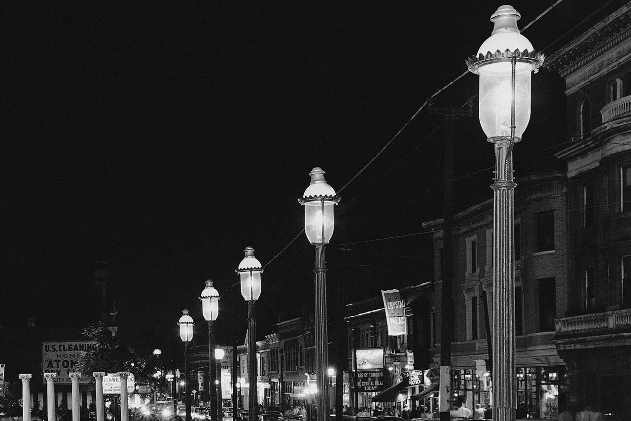 FILE - Gas lamps illuminate St. Louis’ Gaslight Square on April 2, 1962. “Gaslighting” — mind manipulating, grossly misleading, downright deceitful — is Merriam-Webster’s word of 2022. (AP Photo/JMH, File)