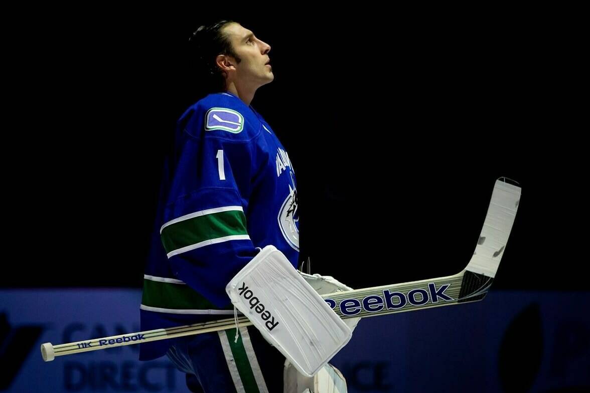 Vancouver Canucks goalie Roberto Luongo looks on during the singing of “O Canada” before playing the Edmonton Oilers during an NHL hockey game in Vancouver, B.C., on Sunday January 20, 2013. Former Vancouver Canucks goaltender Roberto Luongo is to be inducted into the team’s Ring of Honour next season.THE CANADIAN PRESS/Darryl Dyck