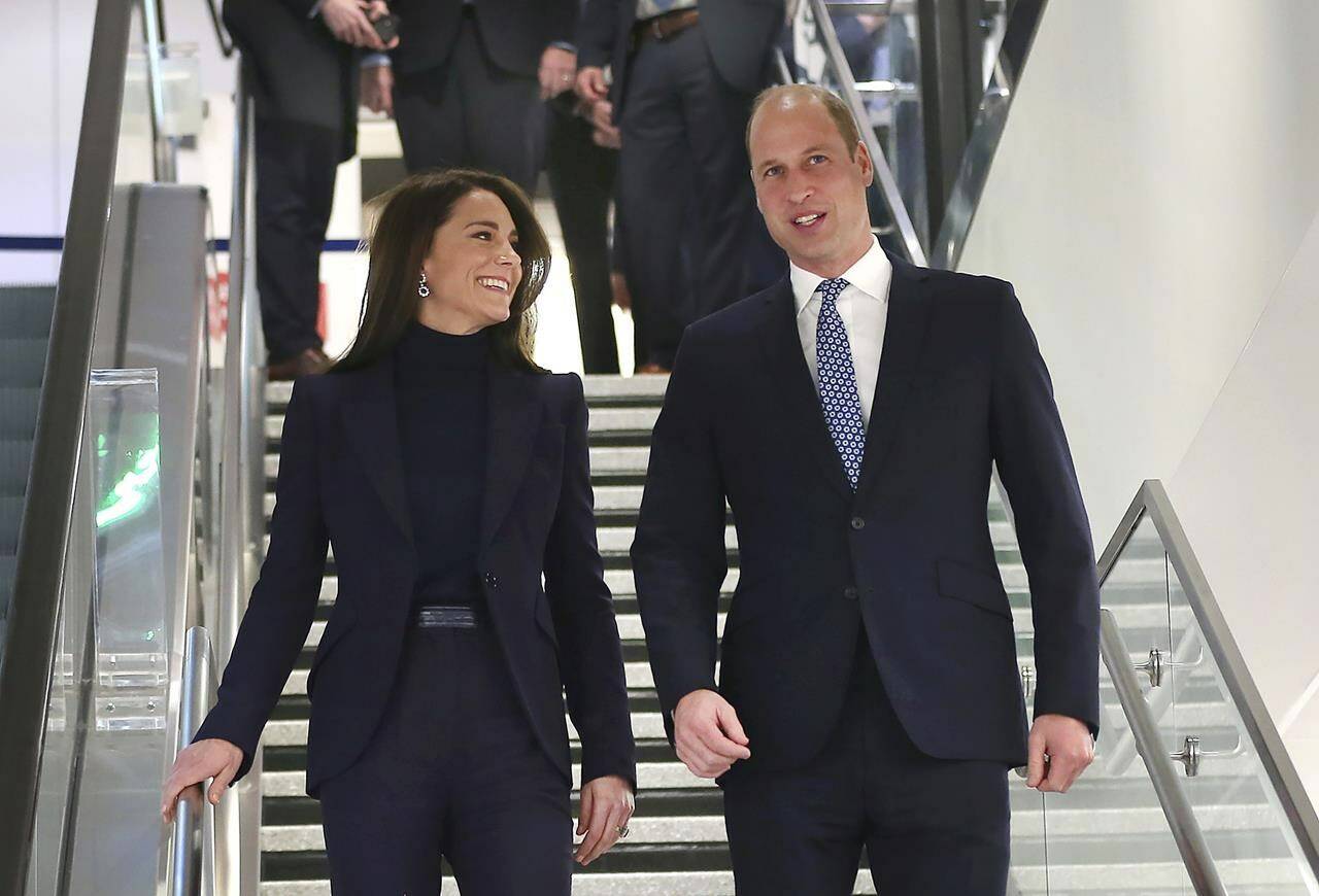 Britain’s Prince William and Kate, Princess of Wales, arrive at Boston Logan International Airport, Wednesday, Nov. 30, 2022, in Boston. The Prince and Princess of Wales are making their first overseas trip since the death of Queen Elizabeth II in September.(John Tlumacki/The Boston Globe via AP)