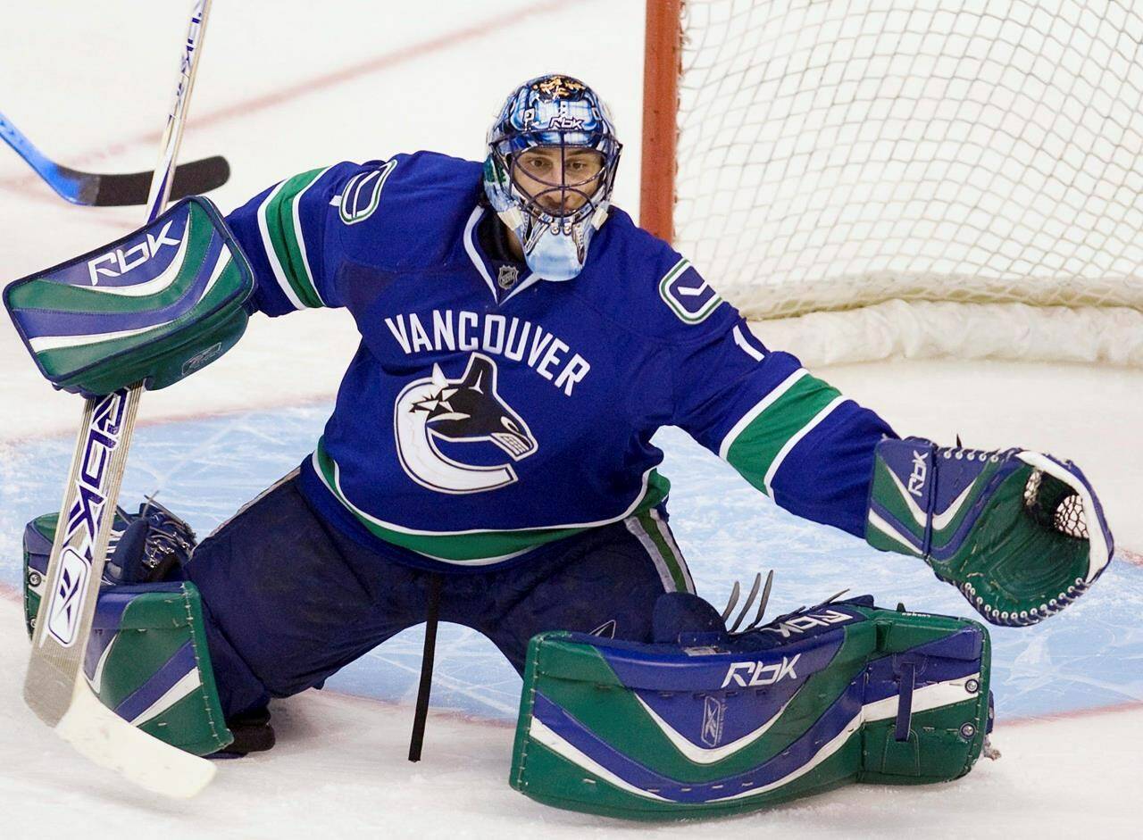 Vancouver Canucks’ goaltender Roberto Luongo makes a save during the third period against the New Jersey Devils at GM Place in Vancouver Tuesday, Dec. 18, 2007. The Canucks won the game 5-0. THE CANADIAN PRESS/Jonathan Hayward