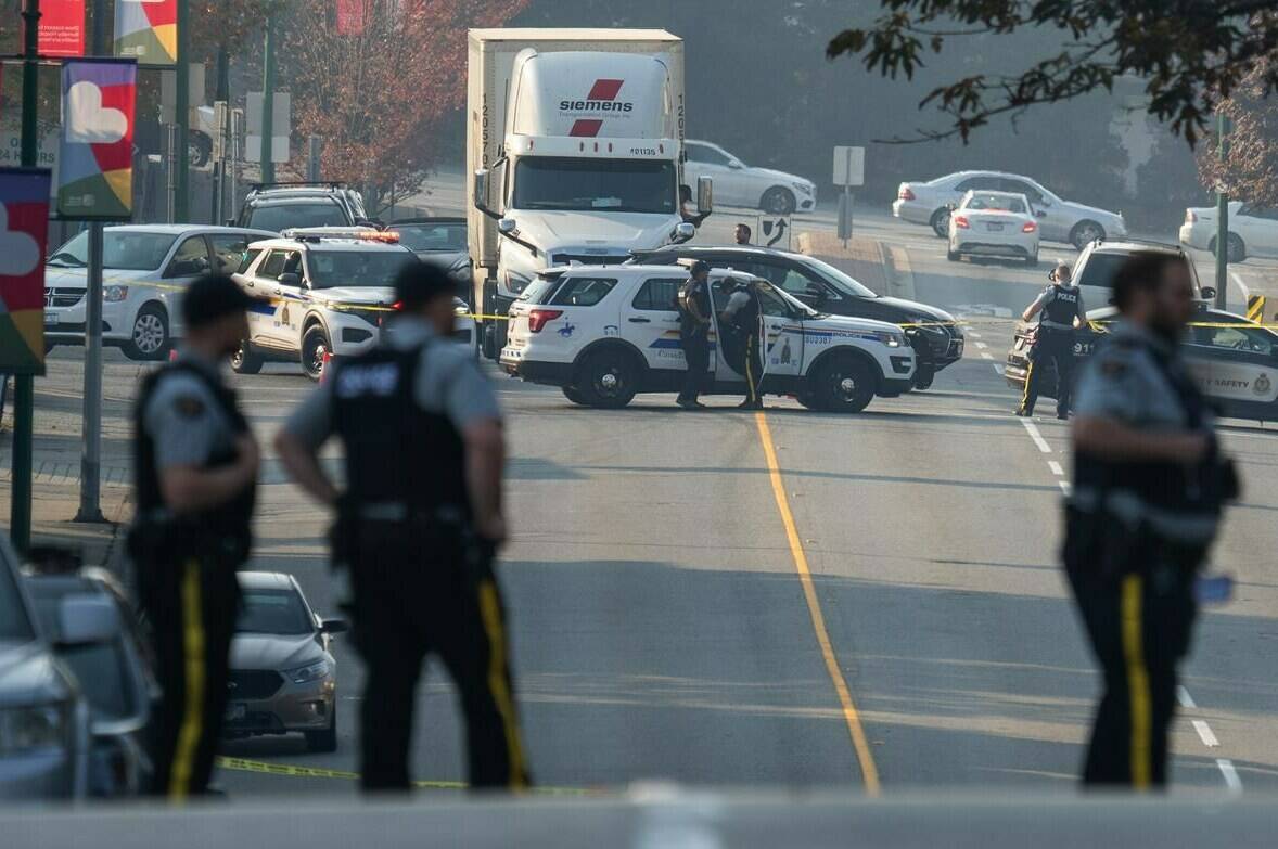 RCMP officers are seen near a homeless encampment where a member of the RCMP was stabbed in Burnaby, B.C. Tuesday, October 18, 2022. British Columbia’s police watchdog says Const. Shaelyn Yang acted appropriately when she shot a man in the altercation that led to her death. THE CANADIAN PRESS/Jonathan Hayward