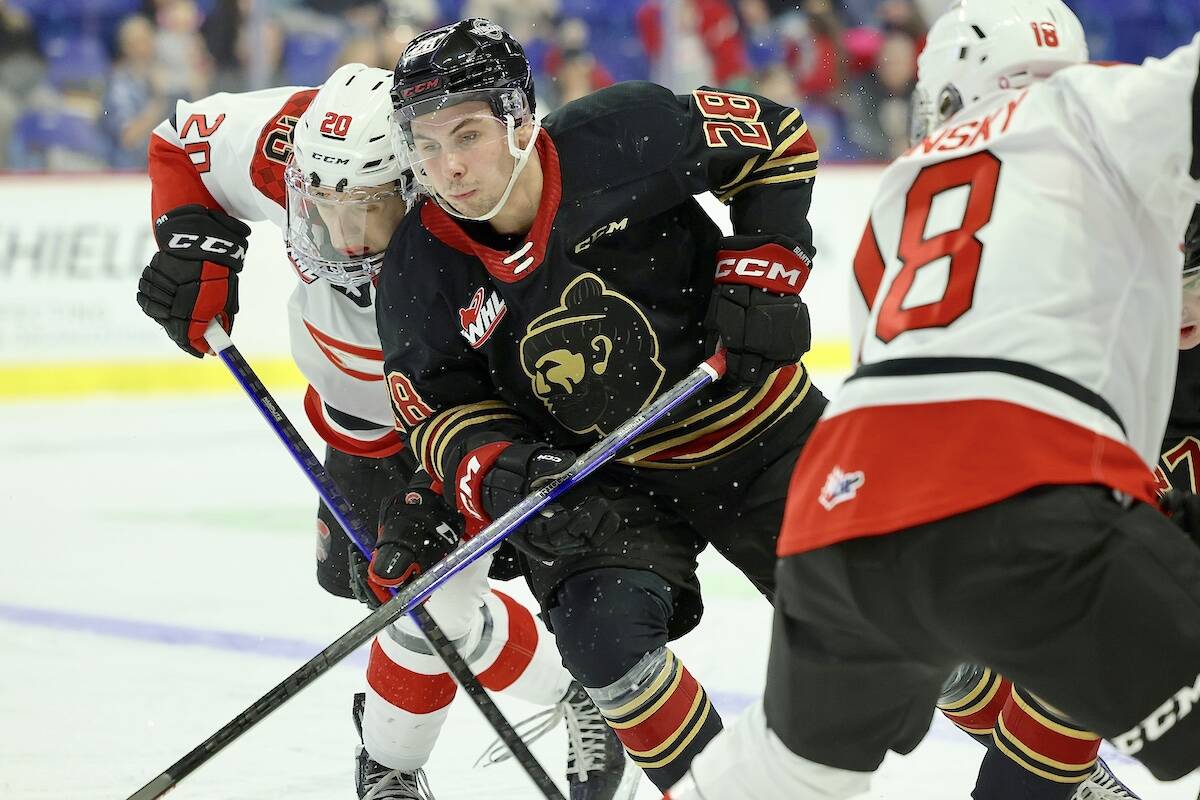 Julian Cull got past two Cougars Sunday afternoon, Dec. 4, before 2,908 fans at Langley Events Centre. Giants led for most of the first two periods, but a huge third period by the Prince George Cougars was too much for the G-men to handle. (Rob Wilton/Vancouver Giants)