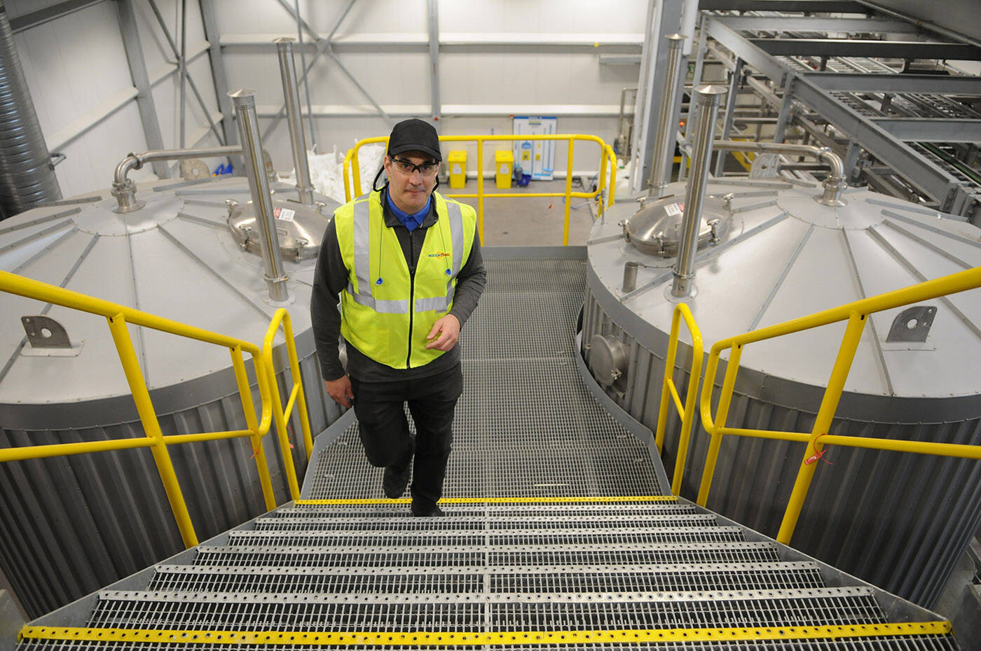 David Hamel, Molson Coors general manager of operations for Western Canada, is seen on March 17, 2022 by the tanks that were converted to produce malt and spirit-based beverages at the Chilliwack brewery. (Jenna Hauck/ Chilliwack Progress)