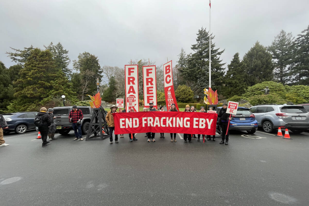 Protestors gathered outside Government House in Victoria on Dec. 7, 2022 to fight against proposals that would see an expansion in the fossil-fuel industry in B.C. (Hollie Ferguson/News Staff)