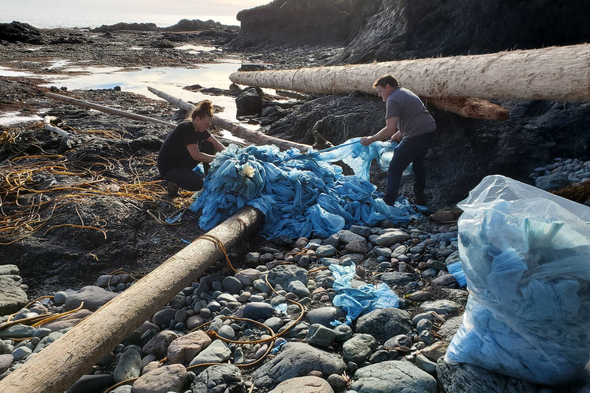 Debris believed to be from the 2021 Zim Kingston freighter spill is shown being collected off Palmerston Beach, on Vancouver Island B.C. in this handout image provided by the by the environmental organization Epic Exeo from February 2022. Those who walk the beaches say debris from the 109 shipping containers that went overboard is still washing up onshore. THE CANADIAN PRESS/HO-Epic Exeo **MANDATORY CREDIT**