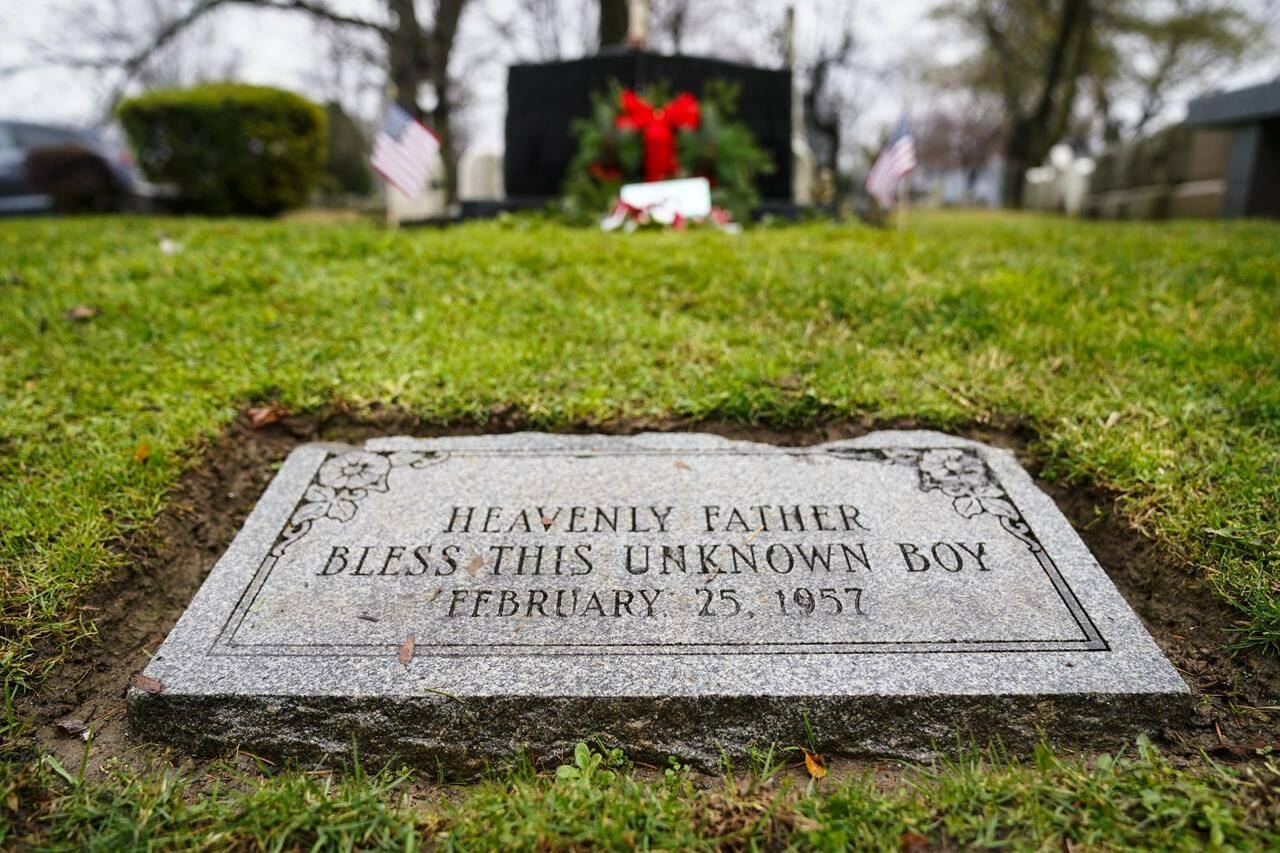 The gravesite of a small boy whose battered body body was found abandoned in a cardboard box decades ago is seen in Philadelphia, Wednesday, Dec. 7, 2022. Nearly 66 years after the boy was found, Philadelphia police are set to reveal the identity of the victim in the city’s most notorious cold case. Police say detective work and DNA analysis helped them learn the name of a youngster who’d been known to generations of Philadelphians as the “Boy in the Box.” Authorities are set to publicly release the victim’s name on Thursday. (AP Photo/Matt Rourke)