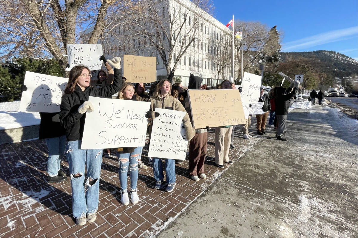 Protesters were lining the street in front of the Williams Lake Courthouse on Dec. 8, 2022, protesting the treatment of survivors of sexual violence. (Ruth Lloyd photo - Williams Lake Tribune)