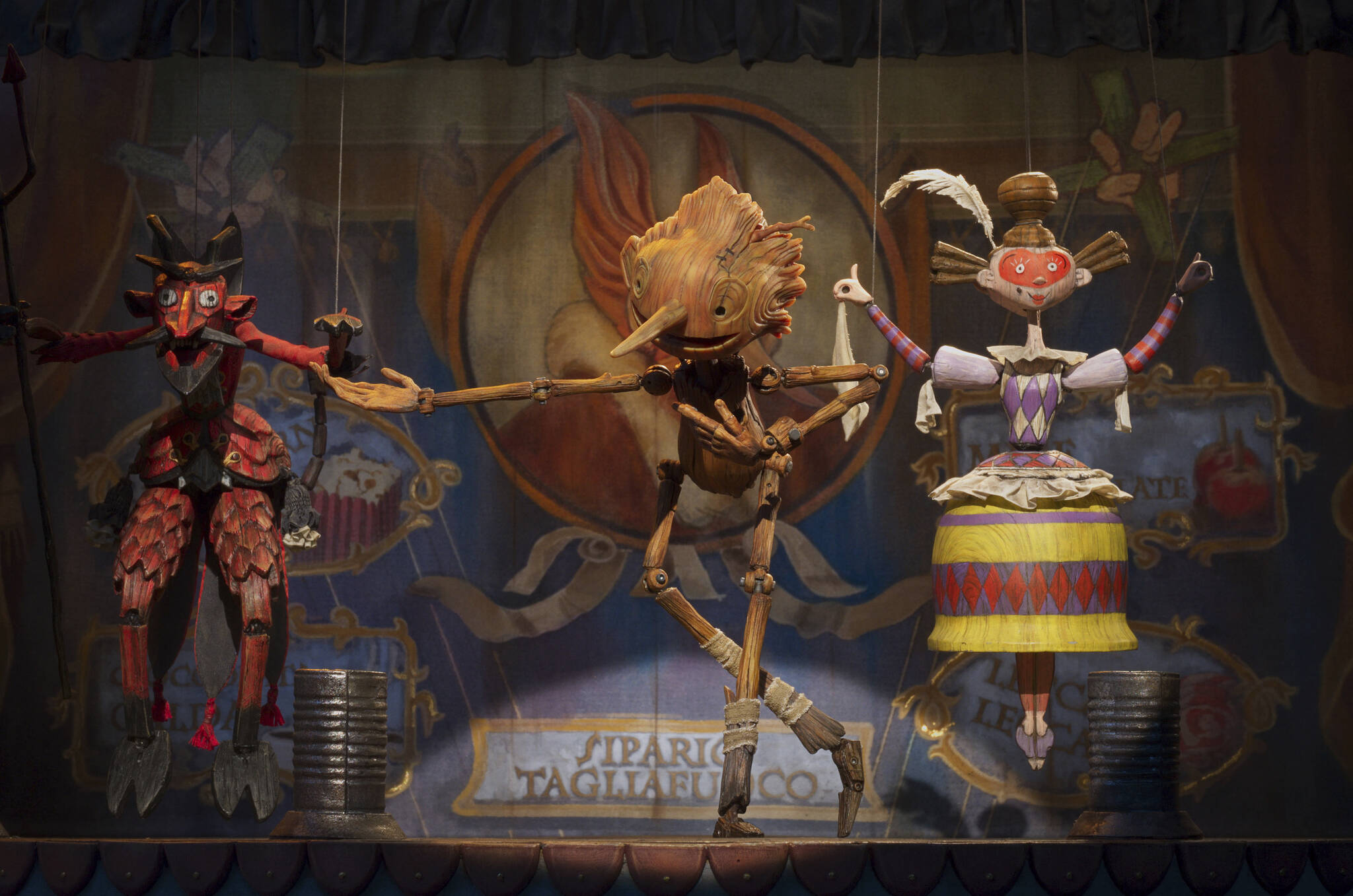 This image released by Netflix shows Pinocchio, voiced by Gregory Mann, center, in a scene from “Guillermo del Toro’s Pinocchio.” (Netflix via AP)