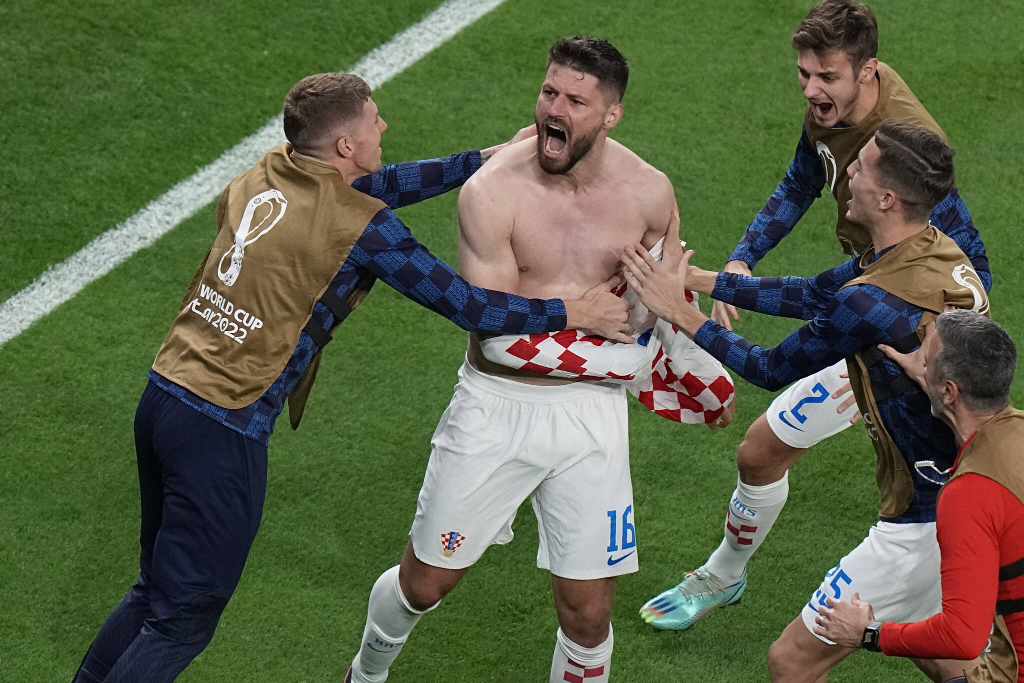 Croatia’s Bruno Petkovic, center, celebrates after scoring his side’s opening goal during the World Cup quarterfinal soccer match between Croatia and Brazil, at the Education City Stadium in Al Rayyan, Qatar, Friday, Dec. 9, 2022. (AP Photo/Pavel Golovkin)