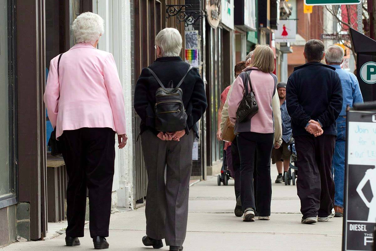 FILE- Senior citizens make their way down a street in Peterborough, Ont. on Monday May 7, 2012. THE CANADIAN PRESS/Frank Gunn