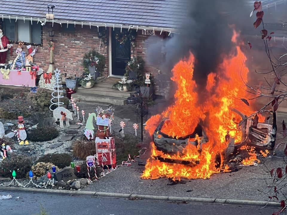 A fully engulfed compact vehicle ablaze in the driveway of a Belcarra Road home Monday morning as photographed by neighbour Alanah Downie. (Courtesy of Alanah Downie)