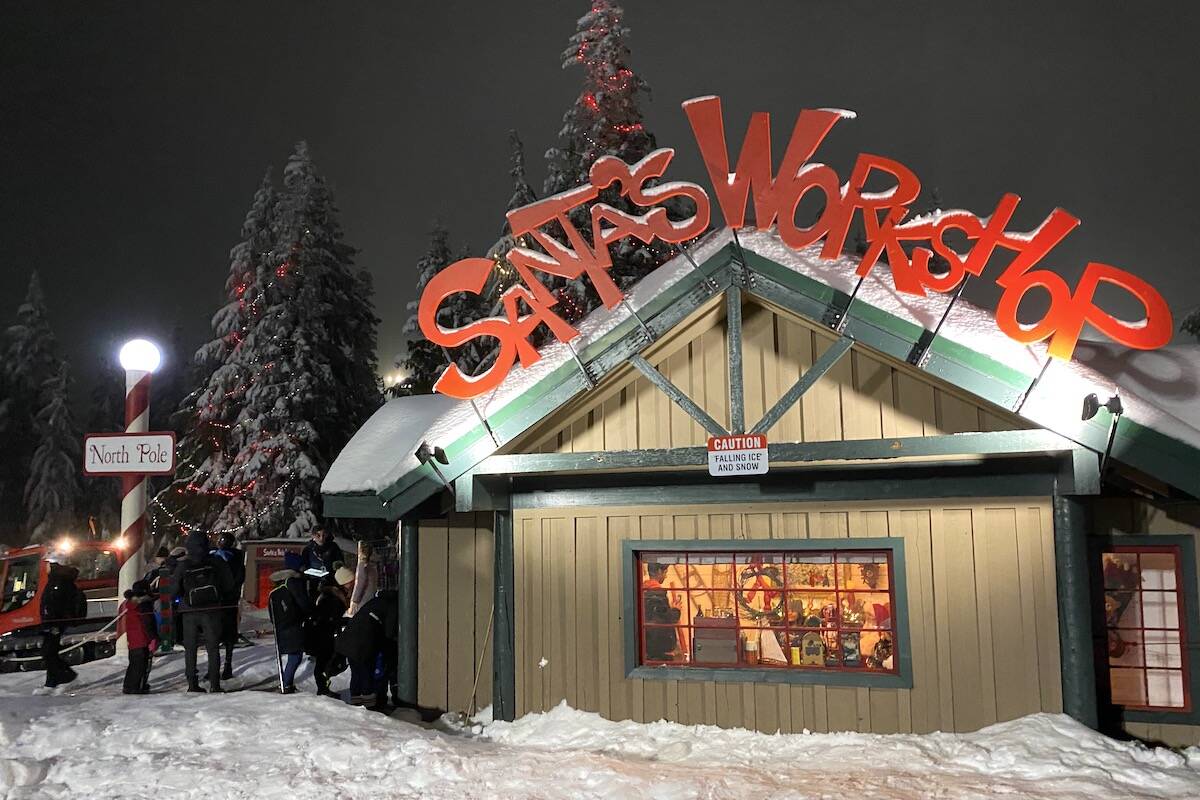 People get their photo with Santa and his workshop, located next to the outdoor skating pond at Grouse Mountain’s annual Peak of Christmas attraction. (Photo: Tom Zillich)