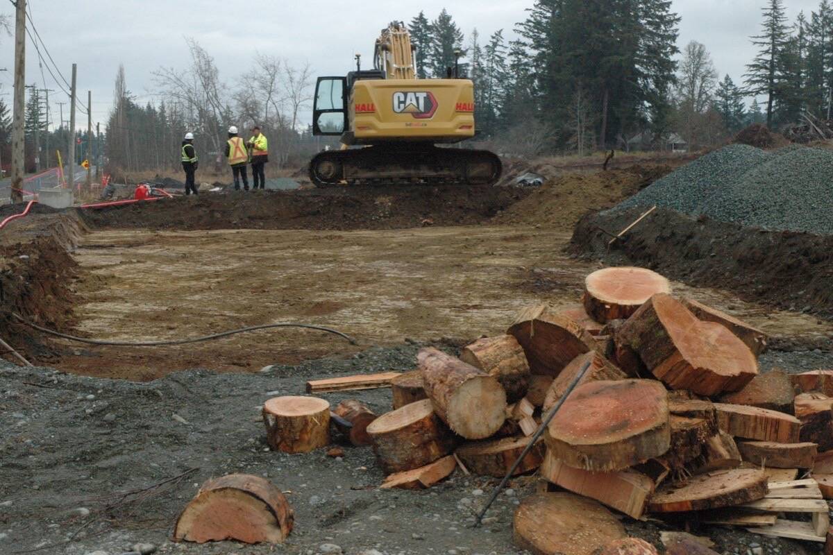 Work resumed at the construction site of the new Cowichan District Hospital on Dec. 13 after workers took down their blockade that had stopped work since Dec. 2. All that remained was a pile of wood that the protesters had used to keep warm during the blockade. (Robert Barron/Citizen)