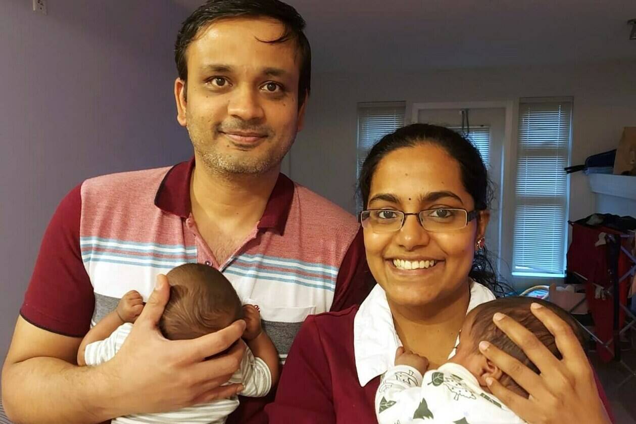 Preethi Krishnan, right, holds her daughter Sudha, as her husband, Ashok Narasimhan, holds twin sister Shraddha in this undated handout photo. The couple took comfort in seeing their premature babies in hospital in between daily visits, thanks to cameras installed at the infants’ bedsides at Richmond Hospital. (Contributed to Canadian Press by Preethi Krishnan)