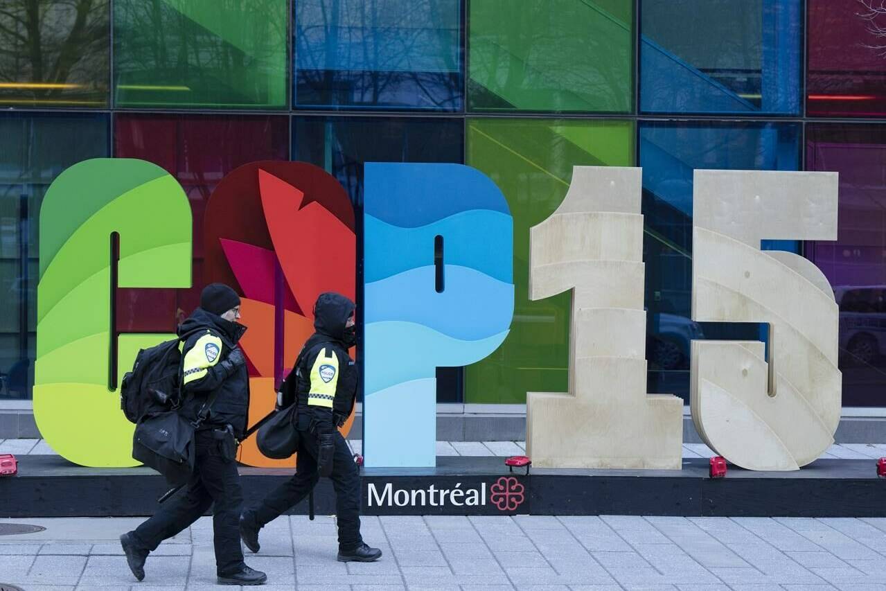 Police officers walk past the convention center at the COP15 biodiversity conference Wednesday, Dec. 14, 2022 in Montreal.THE CANADIAN PRESS/Ryan Remiorz