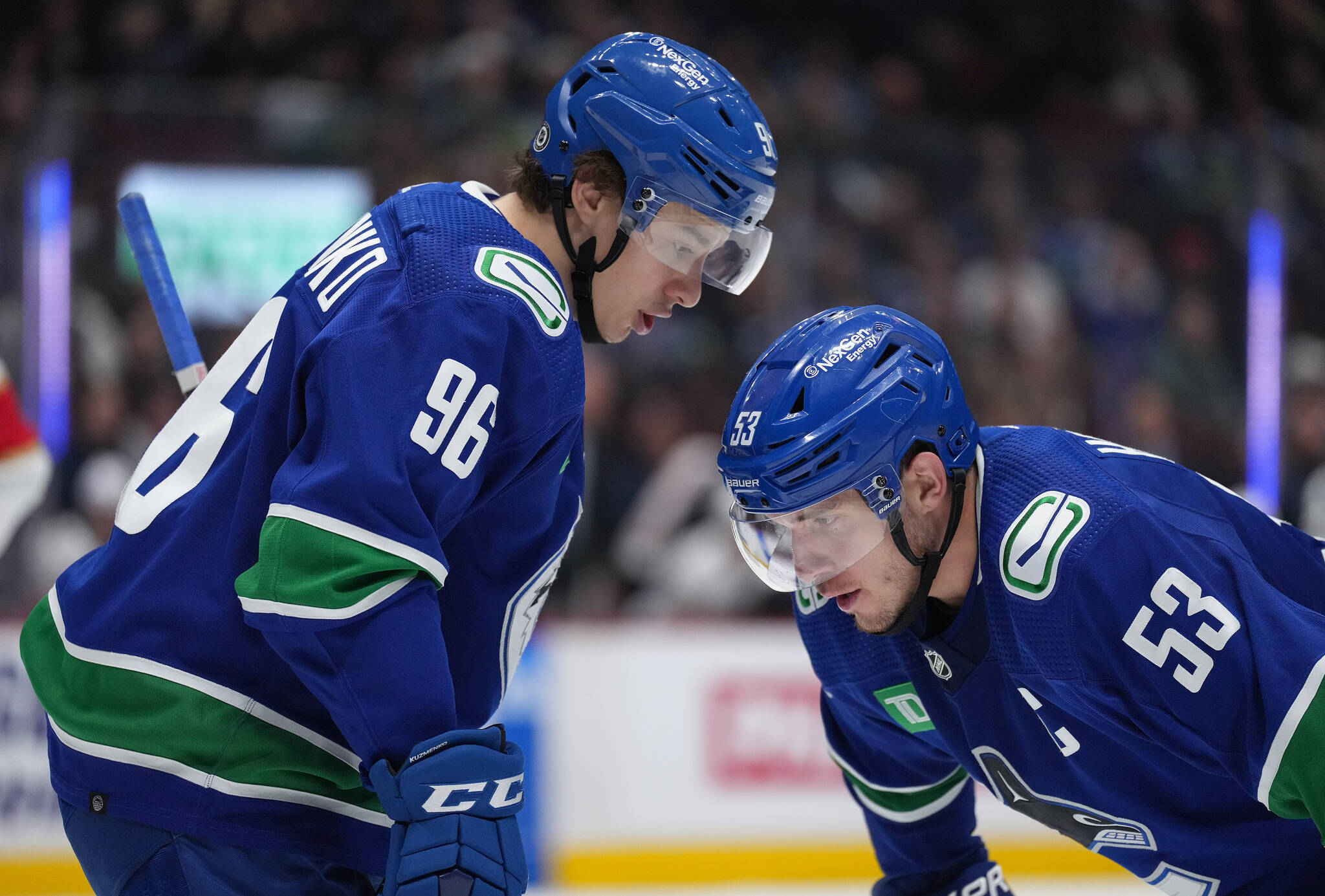 Vancouver Canucks’ Andrei Kuzmenko, left, of Russia, and Bo Horvat talk before a faceoff against the Florida Panthers during the third period of an NHL hockey game in Vancouver, on Thursday, December 1, 2022. THE CANADIAN PRESS/Darryl Dyck